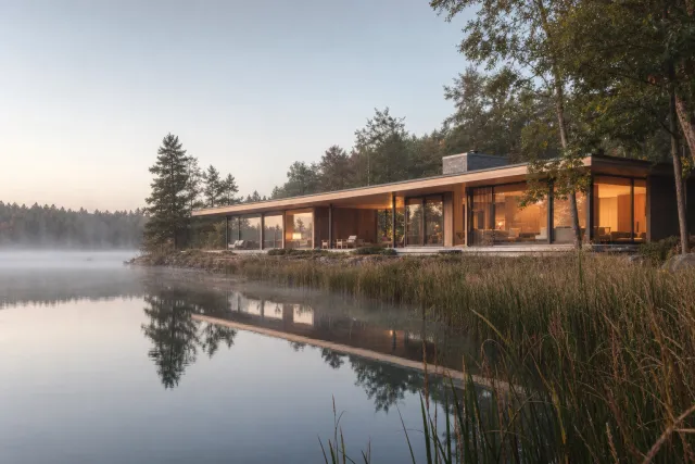 Modern timber house beside a lake