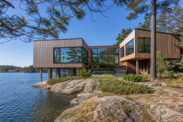 Modern timber residence beside a lake